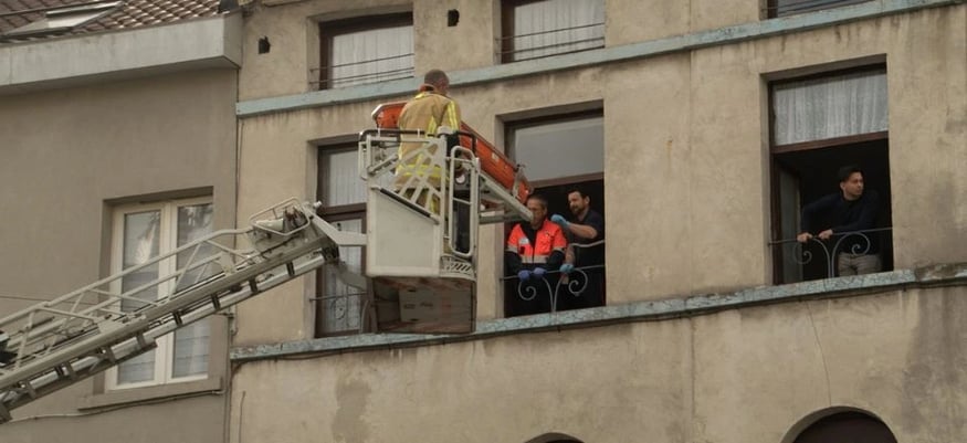 firemen in front of building