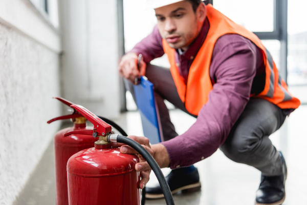 Employee Conducting Fire Risk assessment