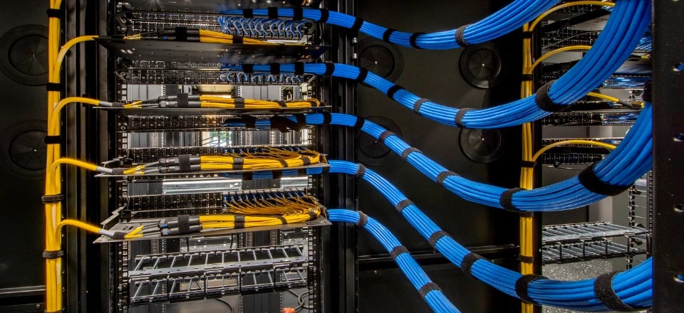 cabling being run from a smart home rack.